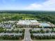 Commercial building with parking and an outdoor swimming pool, all surrounded by a beautiful forest at 1304 Sandpiper Ct, Raleigh, NC 27615