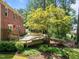 A large brick house with a wooden deck and backyard at 1304 Sandpiper Ct, Raleigh, NC 27615