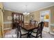 Traditional dining room featuring a large table set, china cabinet, and classic decor at 1304 Sandpiper Ct, Raleigh, NC 27615
