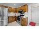Well-equipped kitchen featuring modern appliances, wooden cabinets, and ample counter space at 1304 Sandpiper Ct, Raleigh, NC 27615