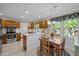 Traditional kitchen with wooden cabinets, stainless steel appliances, and a cozy breakfast nook at 1304 Sandpiper Ct, Raleigh, NC 27615