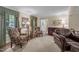 Inviting living room with ample natural light, decorative windows, and comfortable seating at 1304 Sandpiper Ct, Raleigh, NC 27615