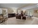 Bright and airy living room with French doors, plush seating, and elegant decor at 1304 Sandpiper Ct, Raleigh, NC 27615