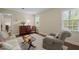 Inviting living room featuring a comfortable seating area, natural light, and hardwood floors at 1304 Sandpiper Ct, Raleigh, NC 27615