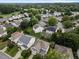 Neighborhood aerial view showing the layout of homes, yards, and green spaces at 132 Ryder Cup Cir, Raleigh, NC 27603