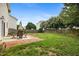 Fenced backyard with a patio, lawn, and mature landscaping at 132 Ryder Cup Cir, Raleigh, NC 27603