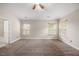 Bright, spacious bedroom with soft carpeting, large windows, and easy access to the bathroom at 132 Ryder Cup Cir, Raleigh, NC 27603