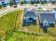 An aerial view displays a well-kept lawn, a home's backyard, and its proximity to neighboring houses at 132 Yellow River Way, Garner, NC 27529