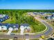 Scenic aerial view of new construction homes in a neighborhood with manicured lawns and tree-lined streets at 132 Yellow River Way, Garner, NC 27529