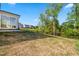 Backyard with a view of neighborhood homes and lush greenery at 132 Yellow River Way, Garner, NC 27529