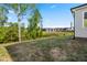 Backyard with a view of neighborhood homes and lush greenery at 132 Yellow River Way, Garner, NC 27529
