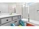 Clean bathroom featuring a shower, toilet, and vanity with a white countertop at 132 Yellow River Way, Garner, NC 27529