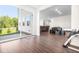 Open dining and living space with hardwood floors and sliding glass door to the backyard at 132 Yellow River Way, Garner, NC 27529