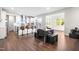 Open kitchen with breakfast bar and casual dining area, features modern cabinets, wood floors, and ample light at 132 Yellow River Way, Garner, NC 27529
