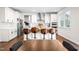 Bright open kitchen with a large island, modern appliances, stylish chairs, and seamless transition to dining at 132 Yellow River Way, Garner, NC 27529