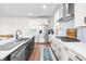 Well-equipped kitchen with stainless steel appliances, a large island, and modern finishes, perfect for cooking at 132 Yellow River Way, Garner, NC 27529