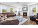 Inviting living room features a cozy fireplace, plush seating, and large windows for ample natural light at 132 Yellow River Way, Garner, NC 27529