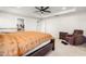 The spacious main bedroom offers comfort and style, enhanced by soft carpeting and a cozy recliner at 132 Yellow River Way, Garner, NC 27529