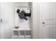 Entryway mudroom with storage cubbies and hooks for coats and bags at 132 Yellow River Way, Garner, NC 27529