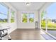Bright sun room with large windows providing natural light and a view of the outdoors at 132 Yellow River Way, Garner, NC 27529