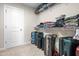 Spacious walk-in closet providing lots of custom shelving, storage for clothes and accessories, and suitcases at 132 Yellow River Way, Garner, NC 27529