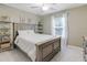 Cozy bedroom with soft, natural light, carpeted floors, and neutral wall paint at 137 Palmdale Ct, Holly Springs, NC 27540