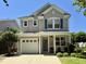 Charming two-story home featuring a well-manicured front yard, attached garage, and inviting front porch at 137 Palmdale Ct, Holly Springs, NC 27540