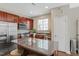 Stylish kitchen with stainless steel appliances, central island, and modern finishes at 137 Palmdale Ct, Holly Springs, NC 27540