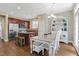 Charming kitchen features an island, stainless steel appliances, and a dining area at 137 Palmdale Ct, Holly Springs, NC 27540