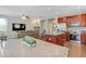 Open-concept layout showcasing kitchen, dining, and inviting living area with TV at 137 Palmdale Ct, Holly Springs, NC 27540