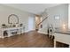 Spacious living room showcasing wood floors, modern decor, and a staircase at 137 Palmdale Ct, Holly Springs, NC 27540