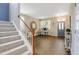 Cozy home interior highlighting staircase, stylish entryway, and wood floors at 137 Palmdale Ct, Holly Springs, NC 27540