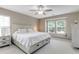 Comfortable main bedroom with a large window, and a carpeted floor at 137 Palmdale Ct, Holly Springs, NC 27540
