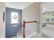Staircase landing with a view of the window, chandelier, and the bedroom at 137 Palmdale Ct, Holly Springs, NC 27540