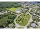 Aerial view of the community amenities including a pool, clubhouse, and tennis courts at 1504 Hemlock Hill Dr, Durham, NC 27703