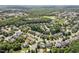 An aerial view of the neighborhood showcasing the beautiful community surrounded by dense trees at 1504 Hemlock Hill Dr, Durham, NC 27703