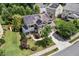 Aerial view of a lovely home featuring solar panels, a welcoming front porch, and a spacious backyard at 1504 Hemlock Hill Dr, Durham, NC 27703