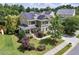 Aerial view of a home with solar panels, a cozy front porch, and a well-maintained yard at 1504 Hemlock Hill Dr, Durham, NC 27703