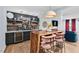 Finished basement features a bar area with a live edge bar, seating, marble counters and custom cabinetry at 1504 Hemlock Hill Dr, Durham, NC 27703