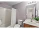 Bathroom with a tub/shower combination, complemented by a vanity and neutral wall color at 1504 Hemlock Hill Dr, Durham, NC 27703