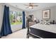 Well-lit bedroom with a large window offering views of the neighborhood, featuring a queen-sized bed at 1504 Hemlock Hill Dr, Durham, NC 27703