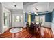 Beautiful dining room with wood floors, natural light, and stylish decor, perfect for Gathering gatherings and entertaining at 1504 Hemlock Hill Dr, Durham, NC 27703