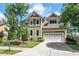 Two-story home featuring an attached two-car garage and well-manicured lawn at 1504 Hemlock Hill Dr, Durham, NC 27703