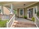 Inviting covered front porch with stone accents and comfortable seating at 1504 Hemlock Hill Dr, Durham, NC 27703