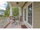 Charming covered porch with seating area and outdoor dining at 1504 Hemlock Hill Dr, Durham, NC 27703