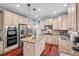 Modern kitchen features stainless appliances, granite countertops, and an island with seating for casual dining at 1504 Hemlock Hill Dr, Durham, NC 27703