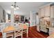 Spacious kitchen with wood floors, a center island, and sightlines to the dining and living areas at 1504 Hemlock Hill Dr, Durham, NC 27703