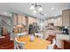 Bright kitchen with stainless steel appliances, an island, and an attached breakfast nook at 1504 Hemlock Hill Dr, Durham, NC 27703