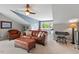 Living area with carpet, neutral paint, an accent wall, and lots of natural light at 1504 Hemlock Hill Dr, Durham, NC 27703