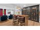 Open-concept basement featuring a stylish living room area, a modern bar, and an elegant wine cellar at 1504 Hemlock Hill Dr, Durham, NC 27703